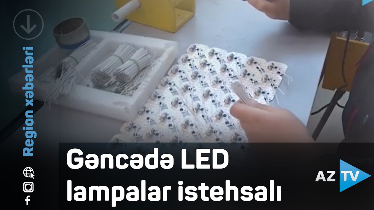 AzTV reportajından kadr: iş masasında LED lövhələr və lampa detalları